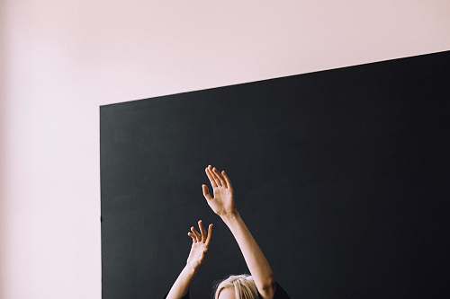 portland person raising both hands arm